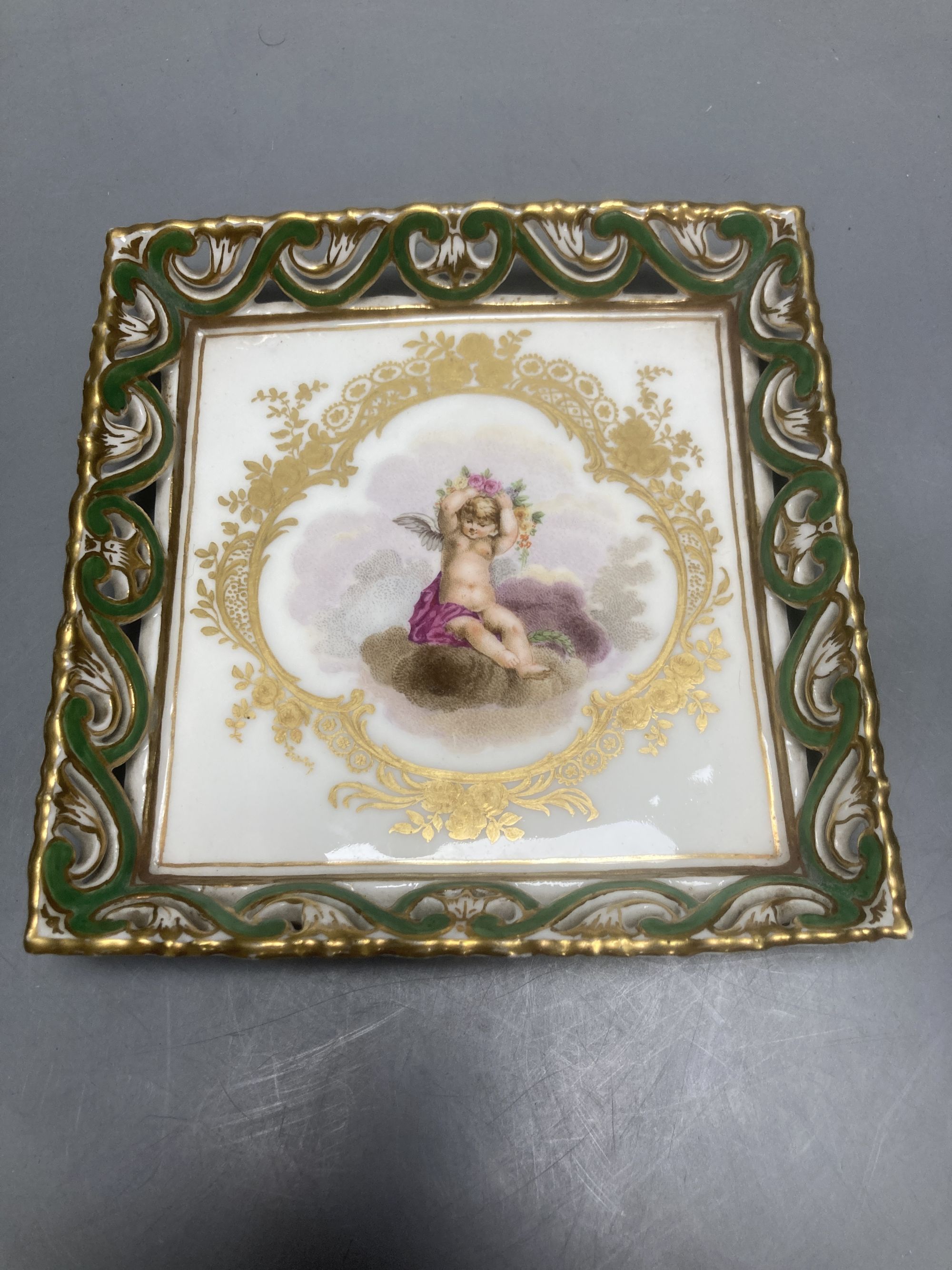 A Sevres square putti decorated dish, 15cm sq.